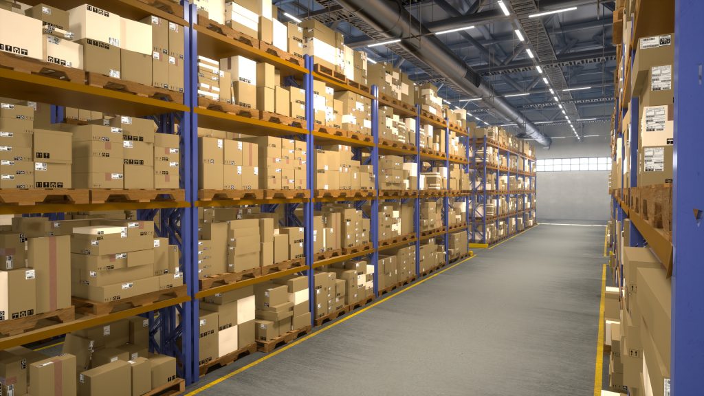 Warehouse shelving system with pallet racking storing boxed inventory in a large industrial warehouse