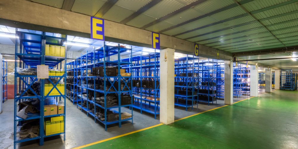 Blue Krost shelving and racking bolt and nut shelves in warehouse.