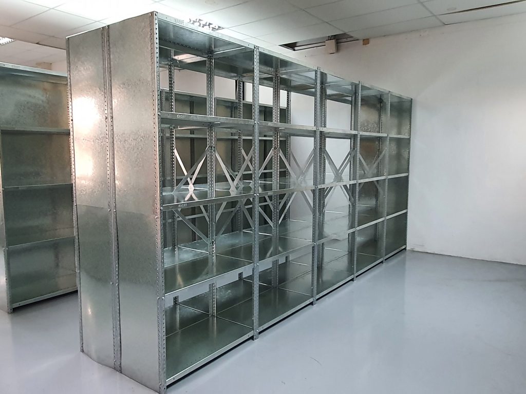 Metal bolted shelving unit in an empty room