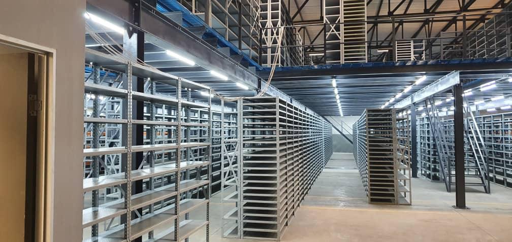 Warehouse interior with bolted shelving system
