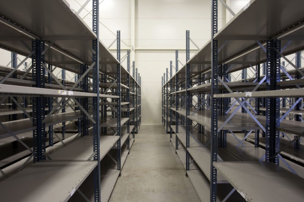 An empty set of bolted shelving solutions in a warehouse setting