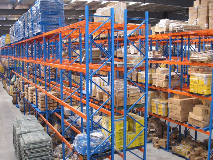 Comparison of selective storage racking vs. mobile shelving in a warehouse and mobile shelving in an warehouse setting