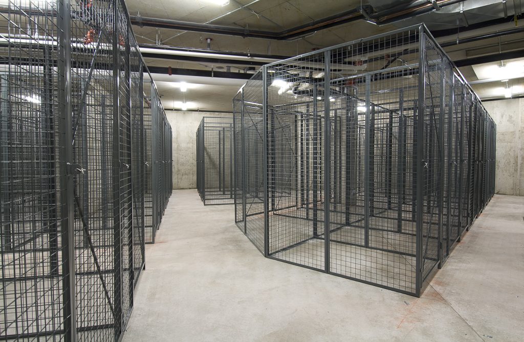 Spacious underground storage facility with rows of large wire mesh lockers, illustrating competitive wire mesh locker prices and secure storage options.