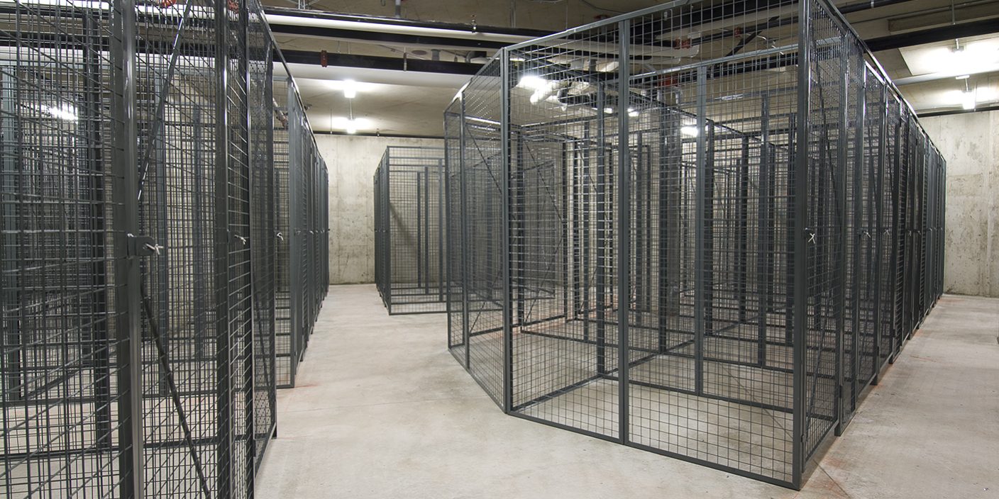 Spacious underground storage facility with rows of large wire mesh lockers, illustrating competitive wire mesh locker prices and secure storage options.