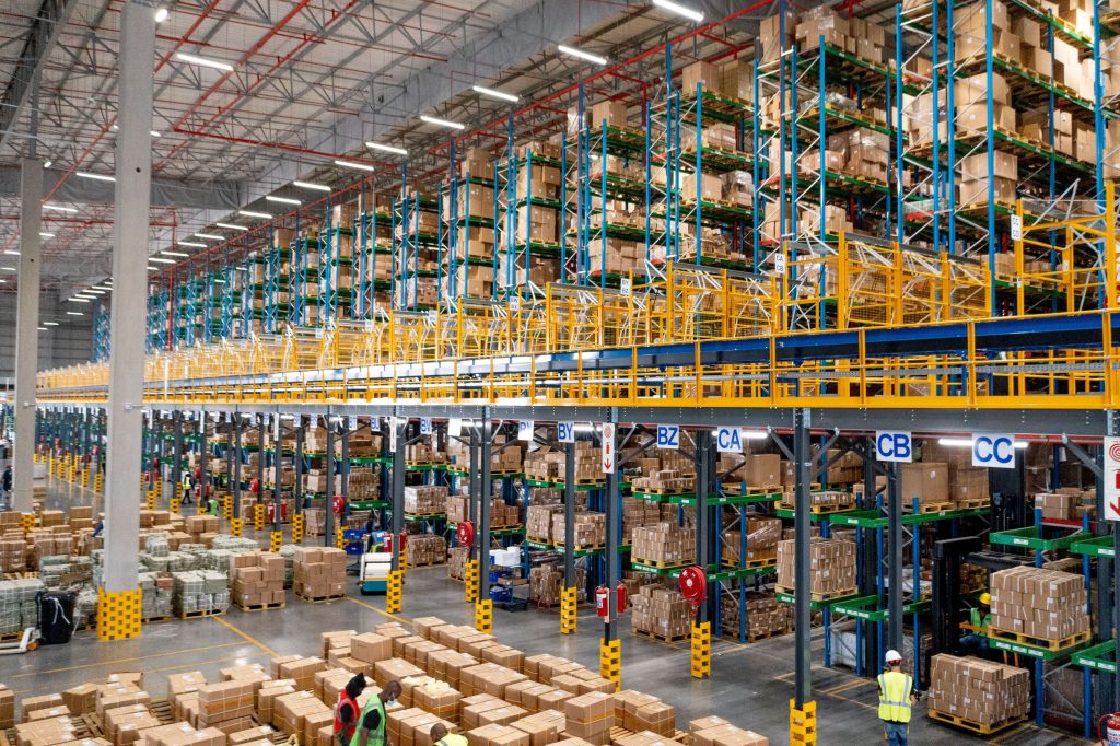 Large warehouse fitted with a stacked blue and yellow VNA racking system to highlight the influences of VNA racking prices
