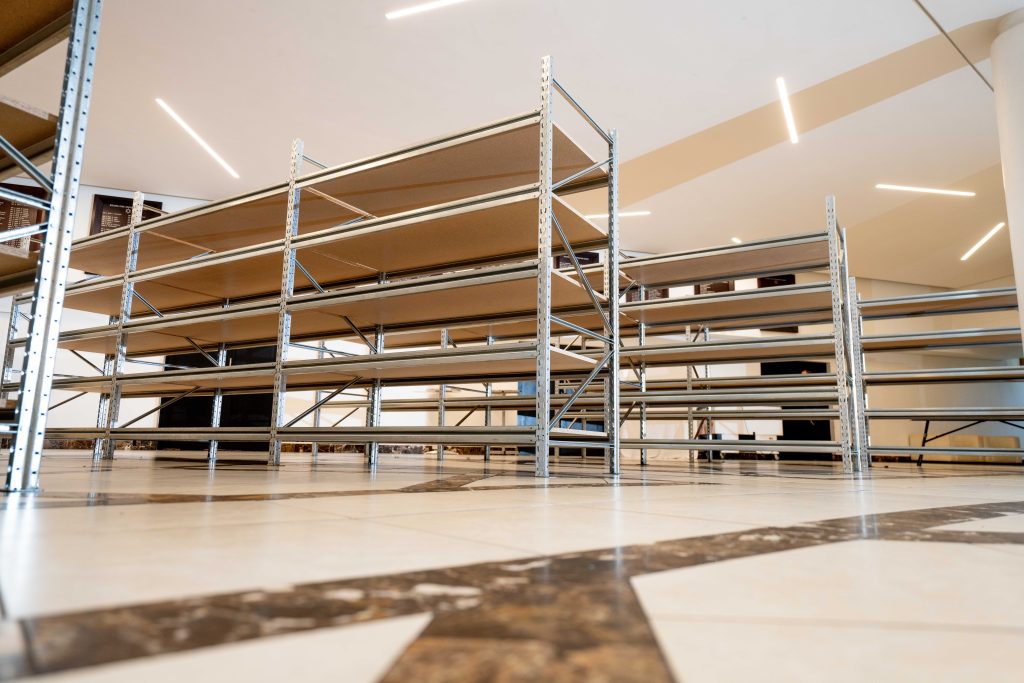 Bottom-up view of multiple long-span shelves in a well-designed hall
