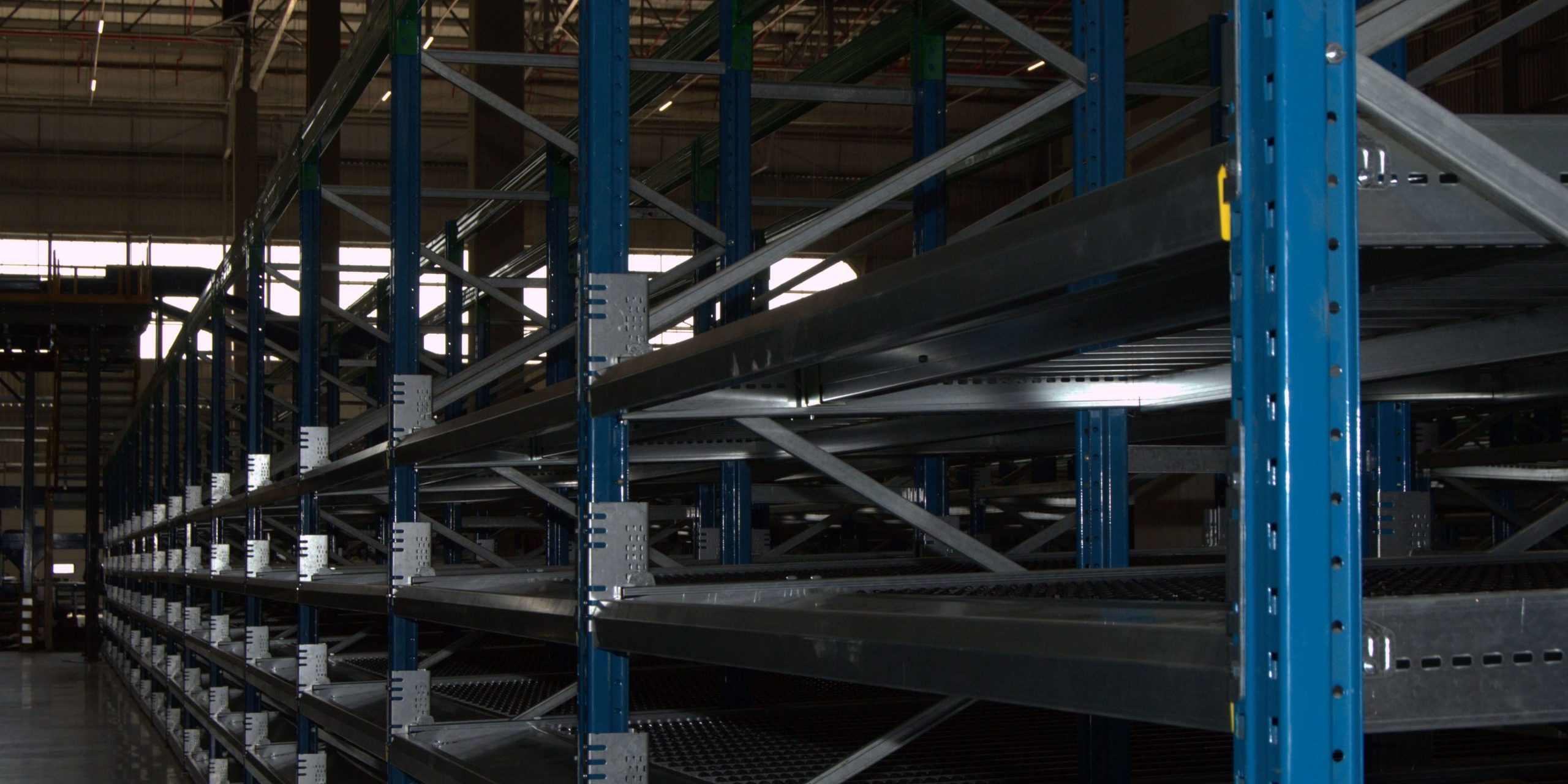 DSC_5698 Neatly installed empty blue steel flow racking system in a warehouse environment