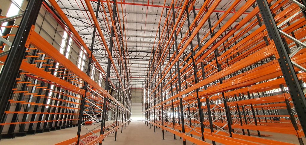 Rivet vs. cantilever shelving: Black and orange rivet shelving storage solution