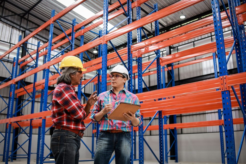People working on vna racking vs. warehouse shelving