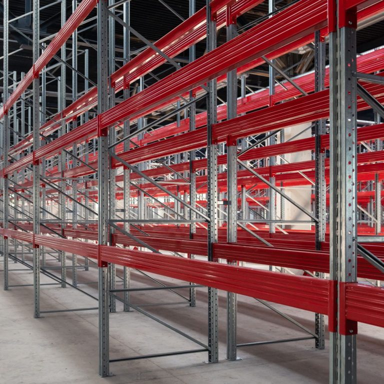 Catwalk racking vs. gondola shelving: Warehouse with an empty multilevel catwalk racking system