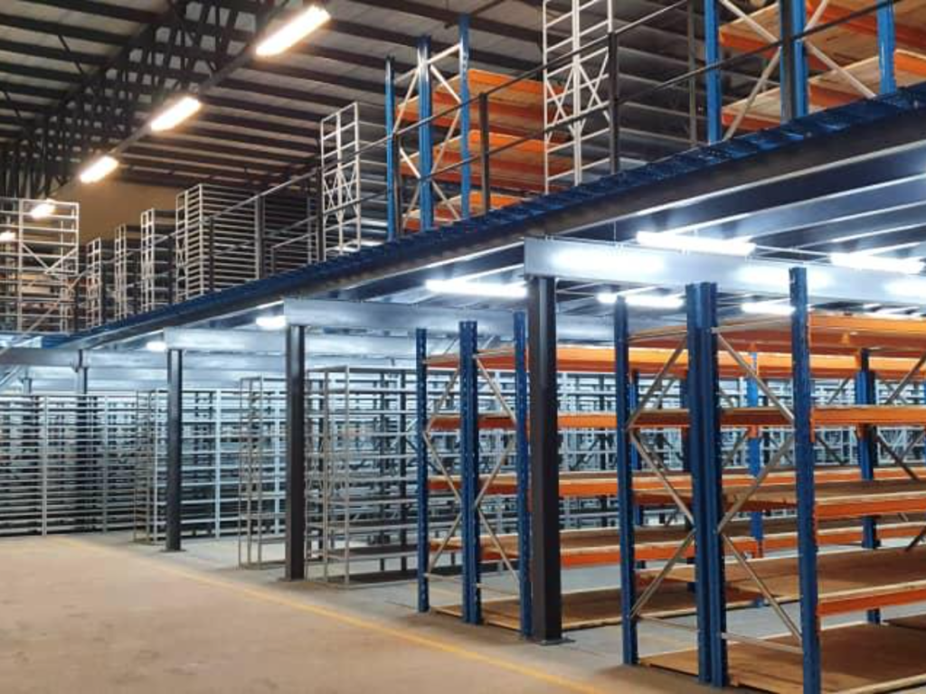 Rows of bolted shelving on ground and second level