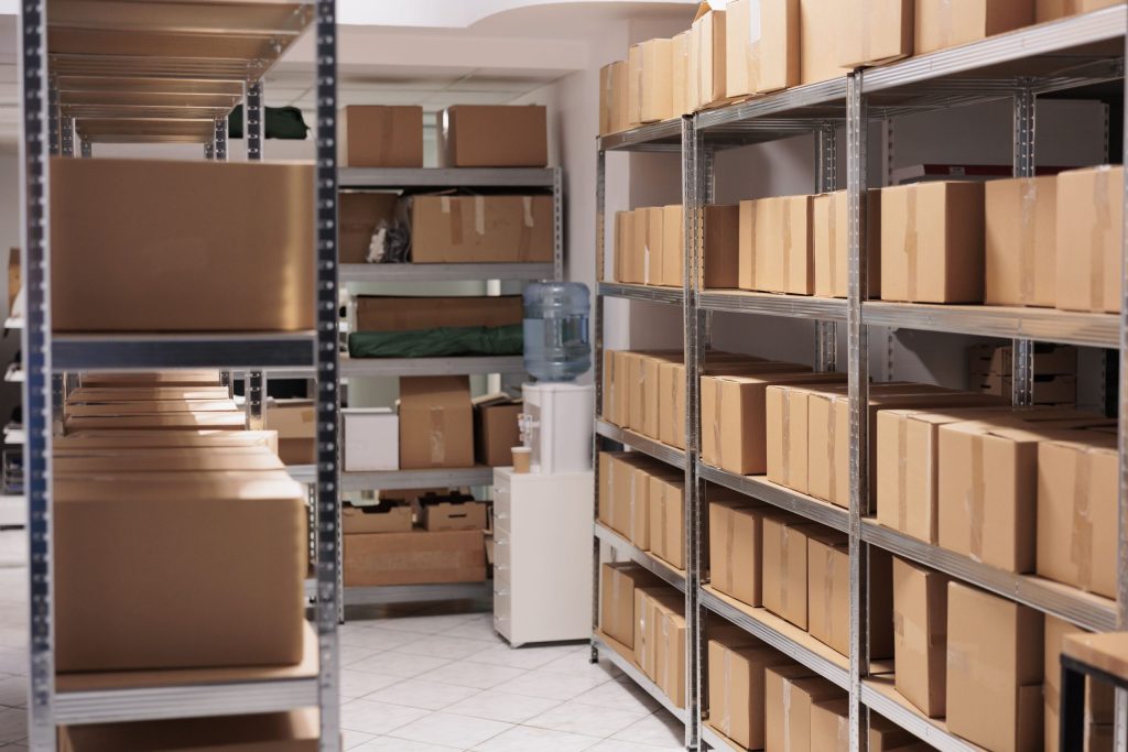 A corporate storehouse fitted with commercial shelving solutions stacked with boxes