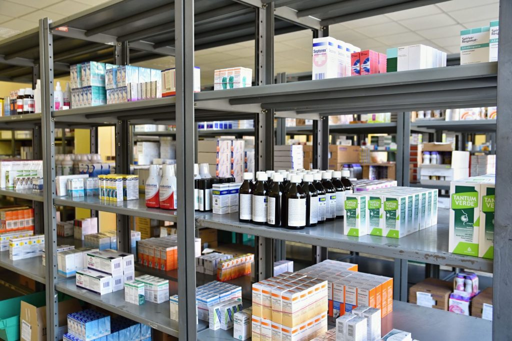 A variety of medicines stored on shelving for healthcare facilities