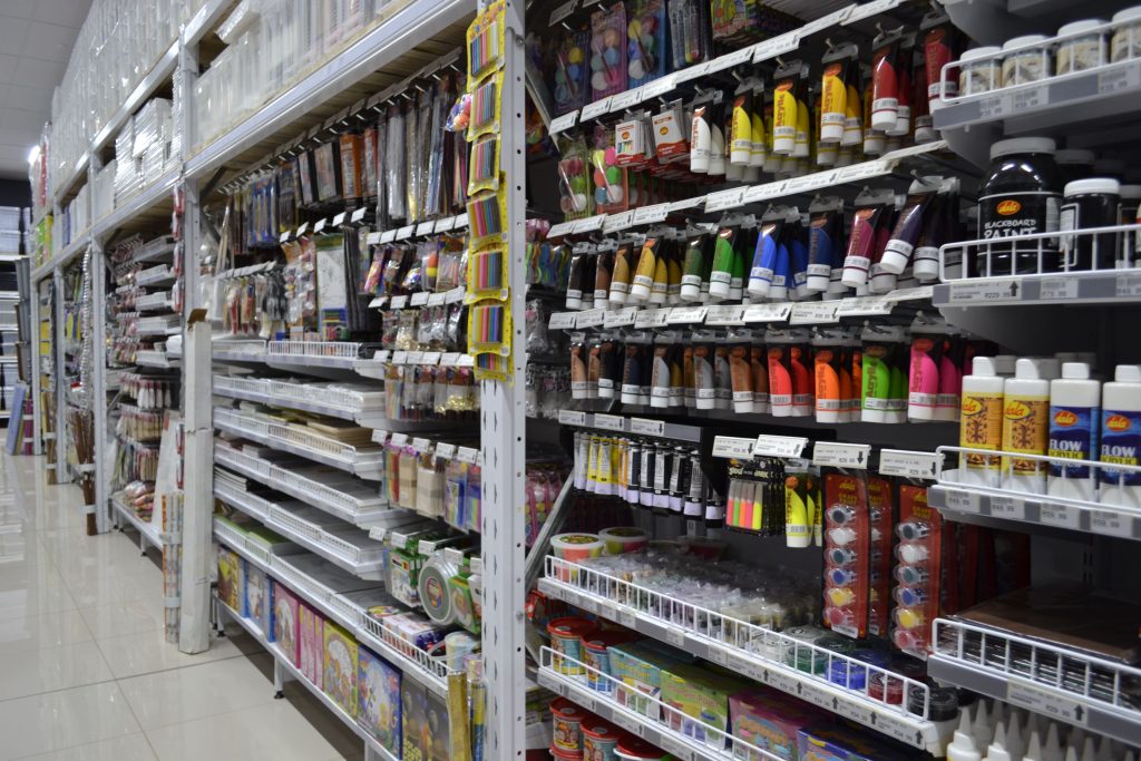 Stationary stacked in a store on a setup bought with gondola shelving prices.