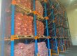 A large set of the best warehouse racking storing potatoes in a warehouse.