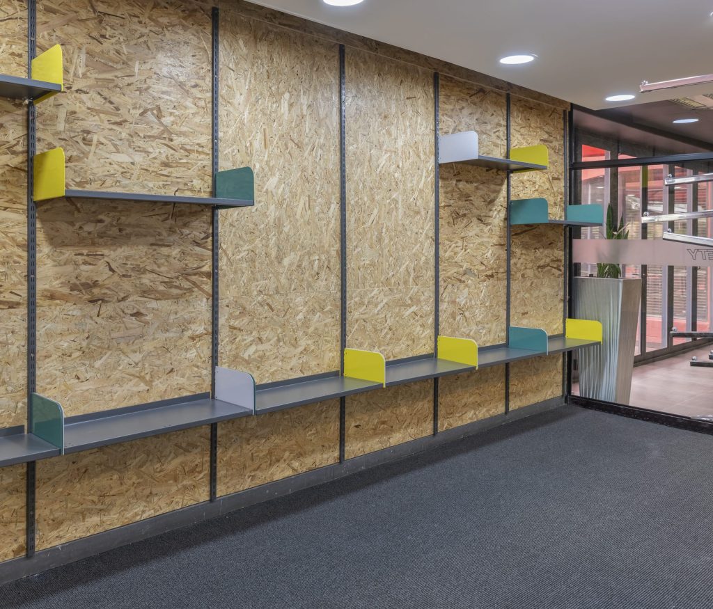 A set of library shelving showing the differences between library shelving and catwalk racking