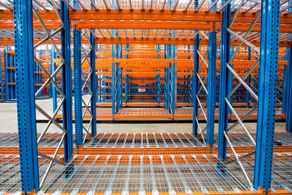 A view of VNA racking through a rack while contrasting VNA vs. push back racking