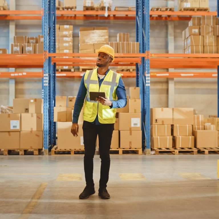 A warehouse worker inspecting goods stored using flexible storage solutions
