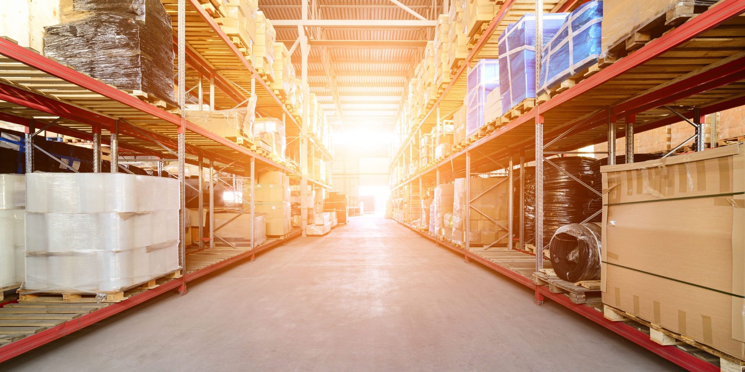 long-shelves-with-variety-boxes-containers (1) Bright sunlight shining into a modern warehouse with racking and shelving installed